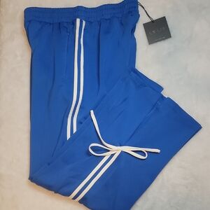 Le Lis Royal Blue Track Pants with White Bow Accents & Zip-up Pockets. Medium